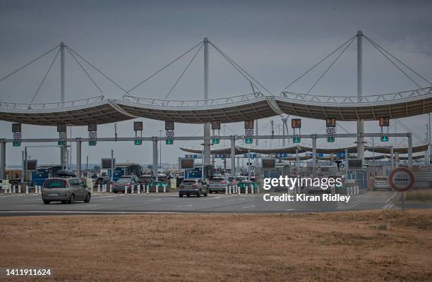 Cars queue at the entrance to Eurotunnel terminal on what is often called the 'Black Weekend' for traffic on July 30, 2022 in Calais, France. This...