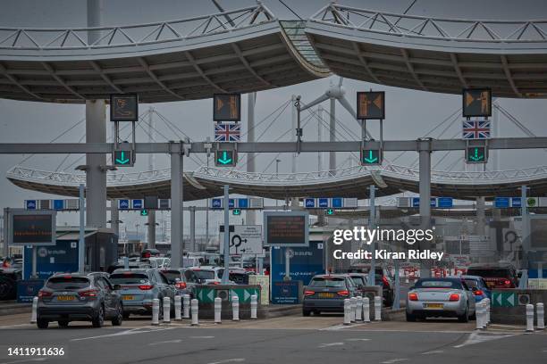 Cars queue at the entrance to Eurotunnel terminal on what is often called the 'Black Weekend' for traffic on July 30, 2022 in Calais, France. This...