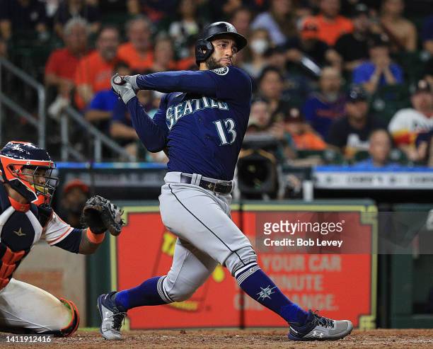 Abraham Toro of the Seattle Mariners hits a two RBI single in the ninth inning against the Houston Astros at Minute Maid Park on July 30, 2022 in...