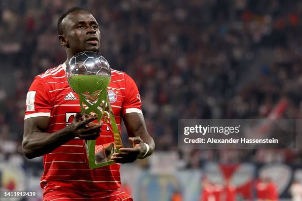 Sadio Mane of FC Bayern München celebrates with the winners trophy after winning the Supercup 2022 match between RB Leipzig and FC Bayern München at...