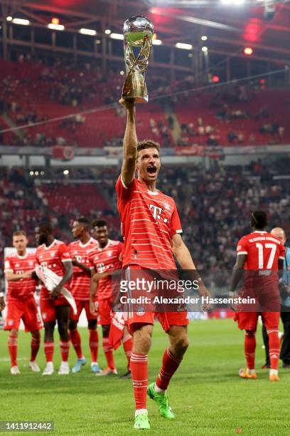 Thomas Müller of FC Bayern München celebrates with the winners trophy after winning the Supercup 2022 match between RB Leipzig and FC Bayern München...