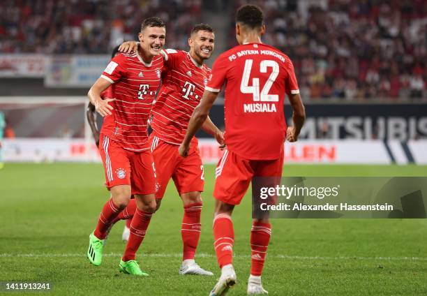 Benjamin Pavard of Bayern Munich celebrates scoring their side's third goal with teammates Lucas Hernandez during the Supercup 2022 match between RB...