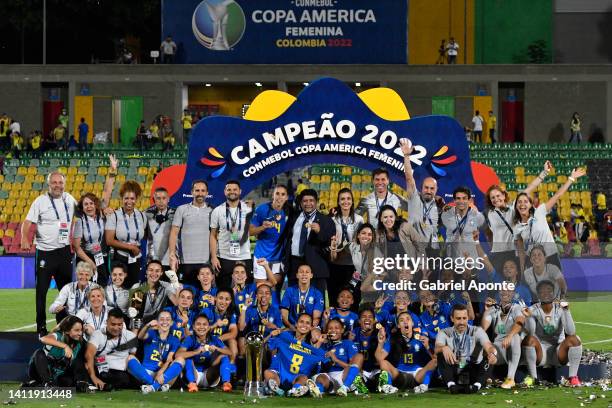 Players of Brazil and team staff celebrate with the trophy after winning the final match between Brazil and Colombia as part of Women's CONMEBOL Copa...