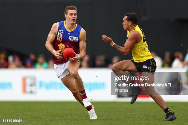 Harrison Arnold of Brisbane is challenged by Sydney Stack of Richmond during the round 19 VFL match between Richmond Tigers and Brisbane Lions at The...