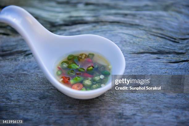 thai fish sauce with sliced chilli dipping - nuoc cham stock pictures, royalty-free photos & images