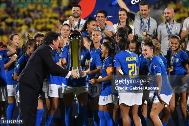 President of CONMEBOL Alejandro Dominguez hands the trophy to Rafaelle of Brazil after the final match between Brazil and Colombia as part of Women's...