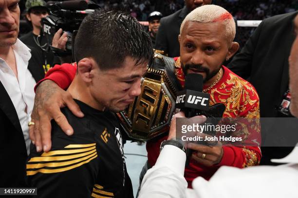 Brandon Moreno of Mexico and Deiveson Figueiredo of Brazil interact after Moreno defeated Kai Kara-France of New Zealand in the interim UFC flyweight...