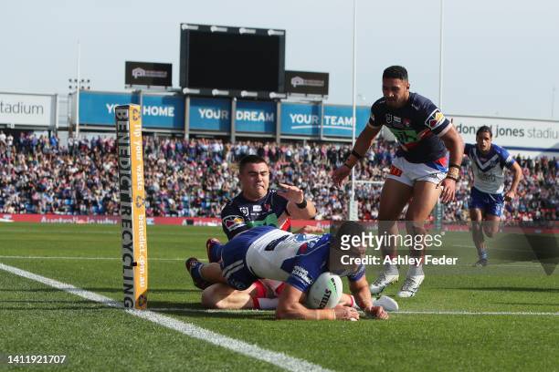 Jacob Kiraz of the Bulldogs scores a try during the round 20 NRL match between the Newcastle Knights and the Canterbury Bulldogs at McDonald Jones...