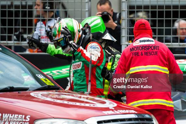 Thomas Randle driver of the Castrol Racing Ford Mustang is attended to by medical staff after being hit by Andre Heimgartner driver of the Brad Jones...