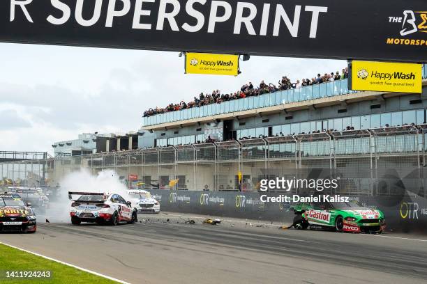 Thomas Randle driver of the Castrol Racing Ford Mustang is hit by Andre Heimgartner driver of the Brad Jones Racing Holden Commodore ZB during race 2...