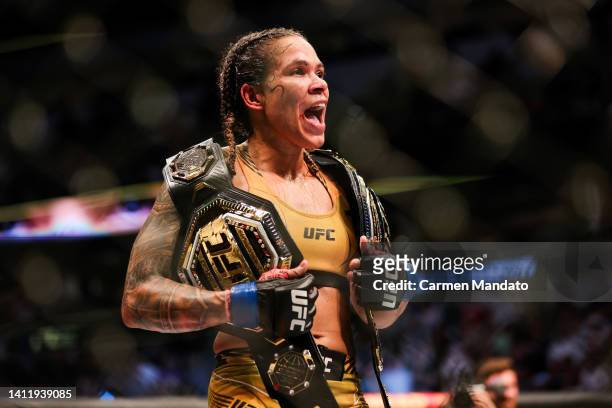 Amanda Nunes of Brazil celebrates after defeating Julianna Pena in their bantamweight title bout during UFC 277 at American Airlines Center on July...