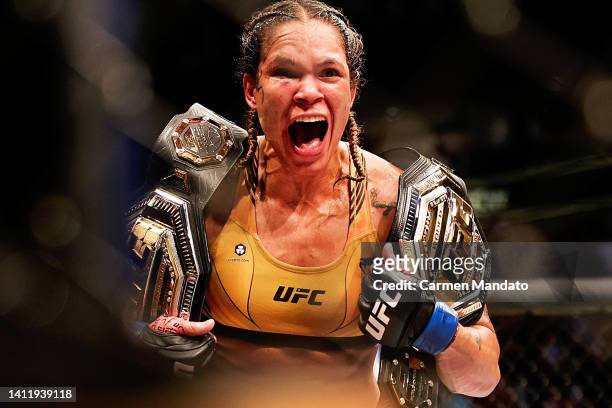 Amanda Nunes of Brazil celebrates after defeating Julianna Pena in their bantamweight title bout during UFC 277 at American Airlines Center on July...