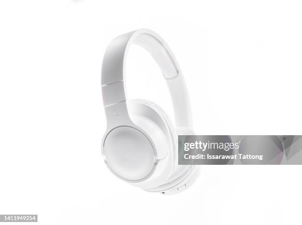 white wireless over-ear (full size) headphones isolated on white background. - earbud stock pictures, royalty-free photos & images