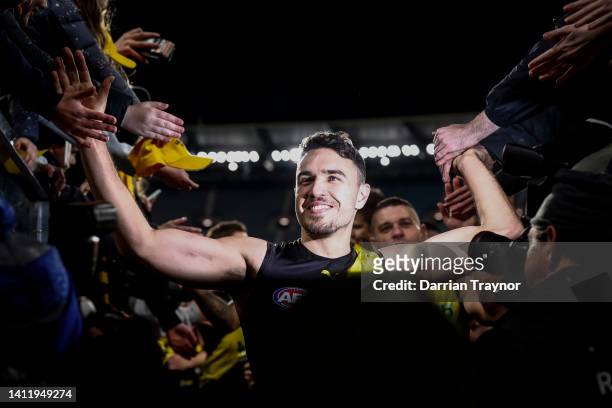 Shane Edwards of the Tigers acknowledges the fans after playing his 300th game during the round 20 AFL match between the Richmond Tigers and the...