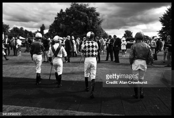 Jockeys enter the parade ring at Goodwood on July 26, 2022 in Chichester, England.