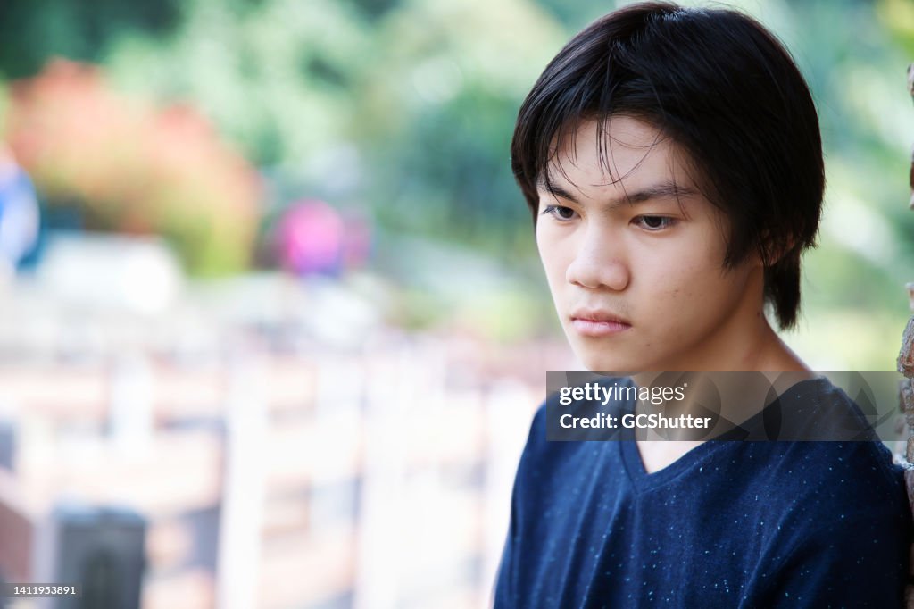 Portrait of an anxious teenager boy