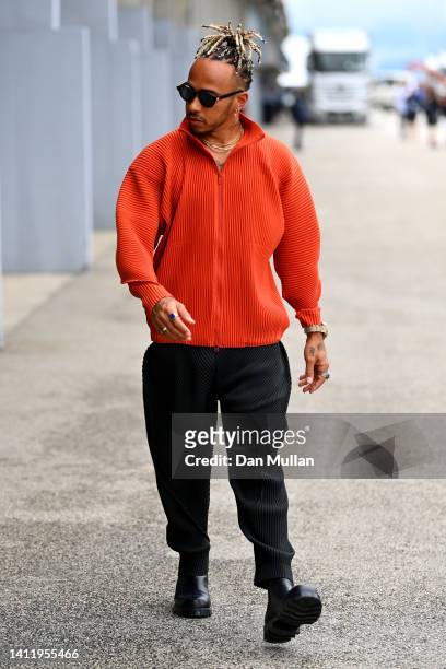 Lewis Hamilton of Great Britain and Mercedes walks in the Paddock ahead of the F1 Grand Prix of Hungary at Hungaroring on July 31, 2022 in Budapest,...