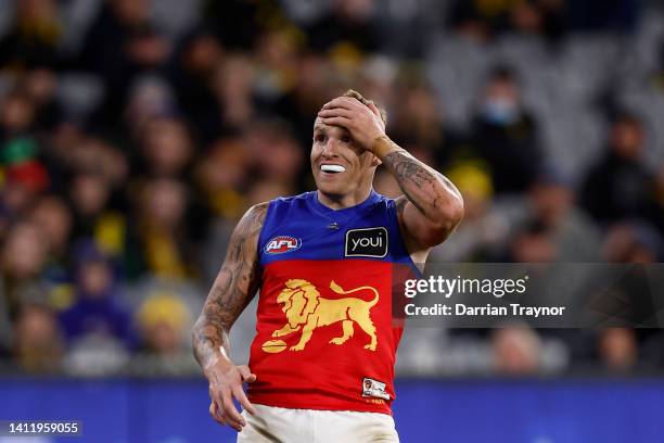 Mitch Robinson of the Lions reacts after missing a goal during the round 20 AFL match between the Richmond Tigers and the Brisbane Lions at Melbourne...