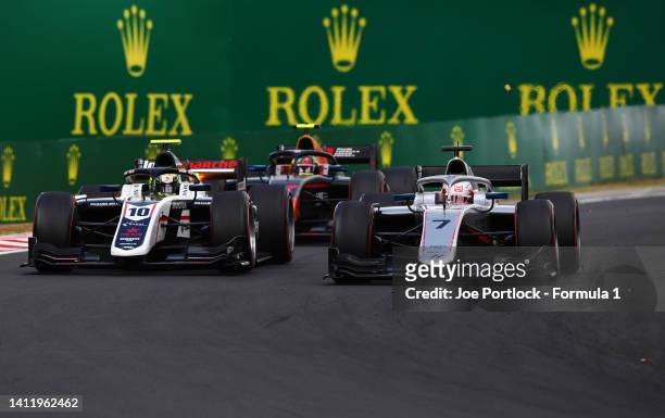 Marcus Armstrong of New Zealand and Hitech Grand Prix and Theo Pourchaire of France and ART Grand Prix battle for track position at the start during...