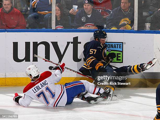 Louis Leblanc of the Montreal Canadiens and Tyler Myers of the Buffalo Sabres collide at First Niagara Center on March 12, 2012 in Buffalo, New York.