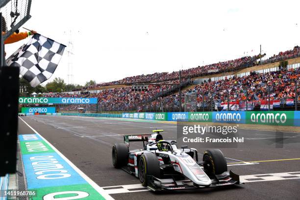 Race winner Theo Pourchaire of France and ART Grand Prix takes the chequered flag during the Round 10:Budapest Feature race of the Formula 2...