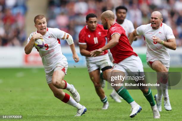 Freddie Roddick of Team England runs with the ball during the Men's 9-12 Semi- Final match between Team England and Team Wales on day three of the...