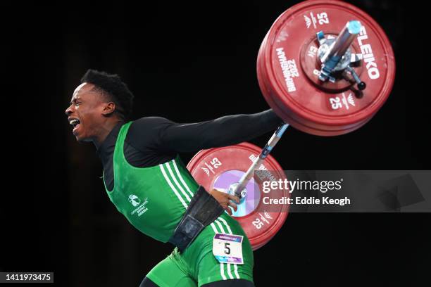 Edidiong Joseph Umoafia of Team Nigeria performs a snatch during the Men's 67kg Final on day three of the Birmingham 2022 Commonwealth Games at NEC...