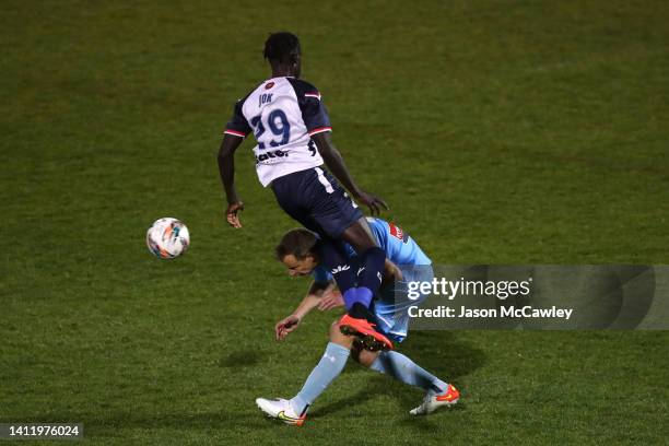 Alex Wilkinson of Sydney FC is challenged by Dor Jok of the Mariners during the Australia Cup Rd of 32 match between Sydney FC and Central Coast...