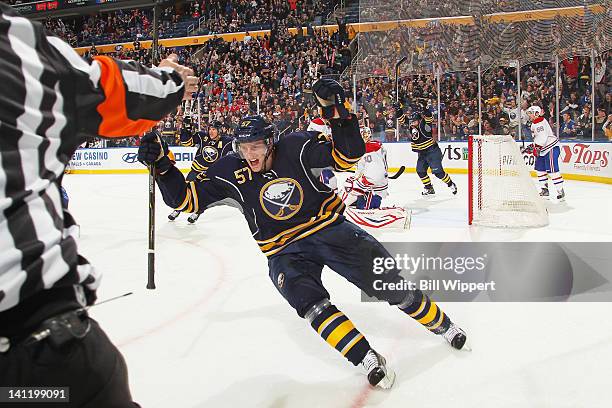Tyler Myers of the Buffalo Sabres celebrates after scoring the game winning overtime goal against Peter Budaj of the Montreal Canadiens at First...