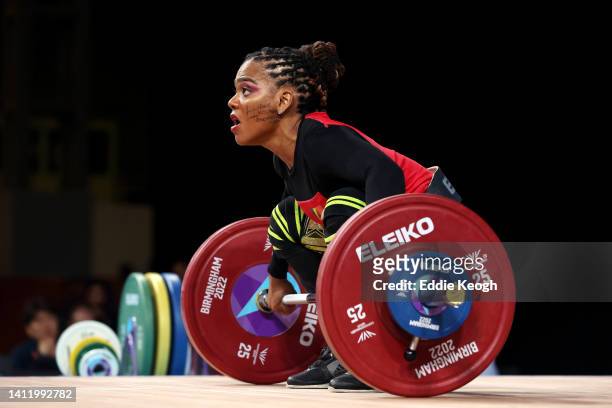 Clementina Ciana Agricole of Team Seychelles performs a snatch as she has written on her face that reads "Abuse, xenophobia, discrimination" during...