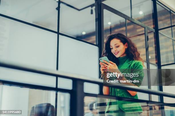 businesswoman in modern office - woman and green colour stock pictures, royalty-free photos & images