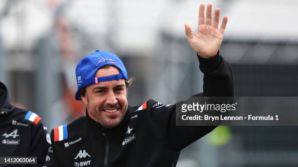 Fernando Alonso of Spain and Alpine F1 waves to the crowd on the drivers parade ahead of the F1 Grand Prix of Hungary at Hungaroring on July 31, 2022...