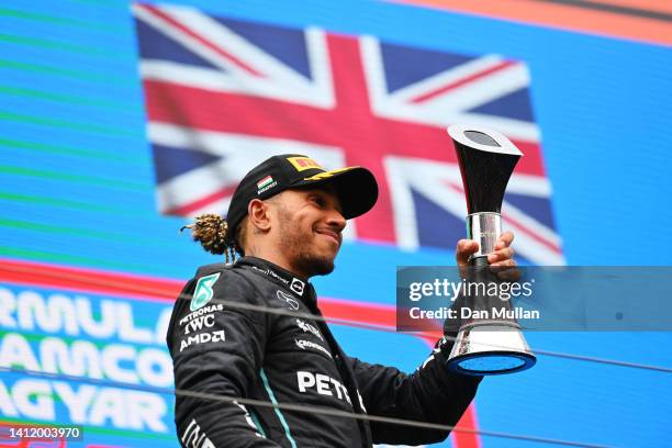 Second placed Lewis Hamilton of Great Britain and Mercedes celebrates on the podium during the F1 Grand Prix of Hungary at Hungaroring on July 31,...