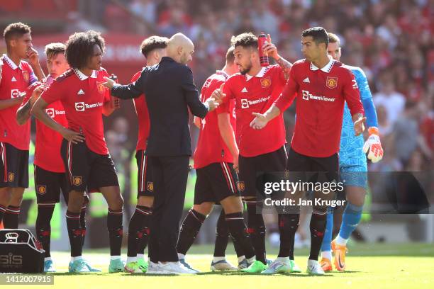 Manchester United manager Erik ten Hag chats with Christiano Ronaldo of Manchester United during the Pre-Season Friendly match between Manchester...