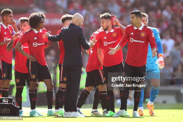 Manchester United manager Erik ten Hag chats with Christiano Ronaldo of Manchester United during the Pre-Season Friendly match between Manchester...
