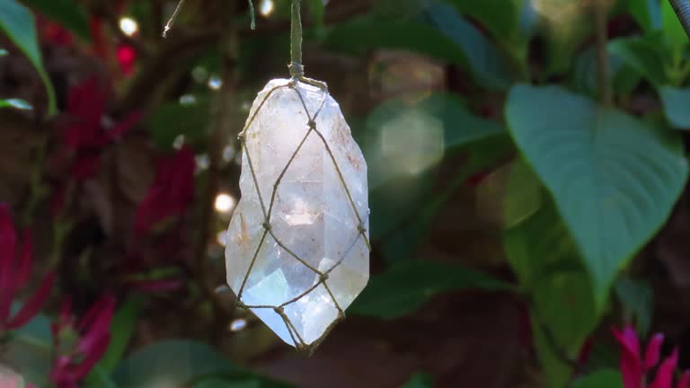 https://media.gettyimages.com/id/1412010262/video/rough-point-of-rock-crystal-as-a-pendant-for-home-garden-decor.jpg?b=1&s=640x640&k=20&c=3GqY0-0aAW1ck_m1M7p5mw_m3BSz0YC_ddYEWnIn9TY=