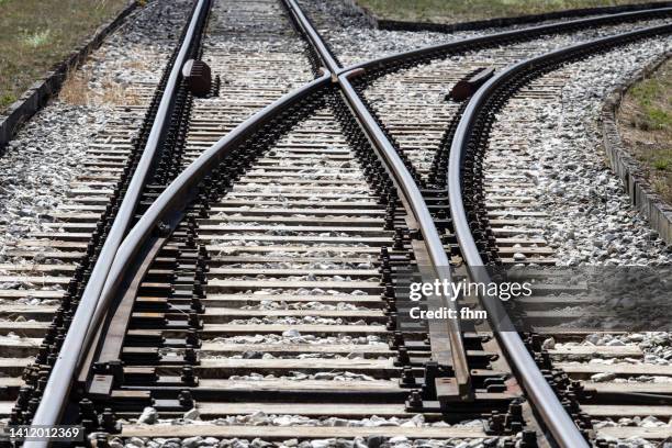 switch at a railroad track - schienenverkehr stock-fotos und bilder