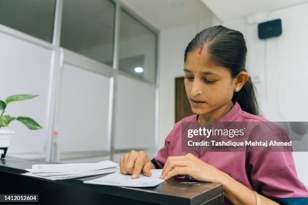 young indian nurse in a doctor's clinic. - assam people stock pictures, royalty-free photos & images