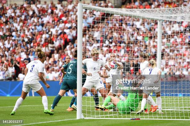 Leah Williamson of England attempts to clear the ball which was sent to VAR for a potential handball during the UEFA Women's Euro 2022 final match...
