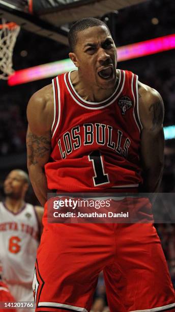 Derrick Rose of the Chicago Bulls lets out a scream after dunking the ball against the New York Knicks at the United Center on March 12, 2012 in...