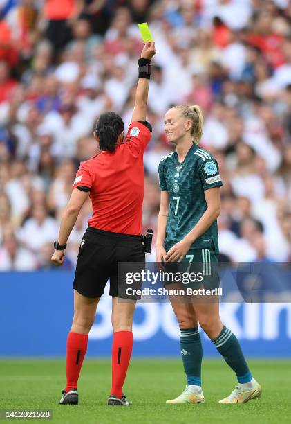 Match Referee Kateryna Monzul issues a yellow card to Lea Schuller of Germany during the UEFA Women's Euro 2022 final match between England and...