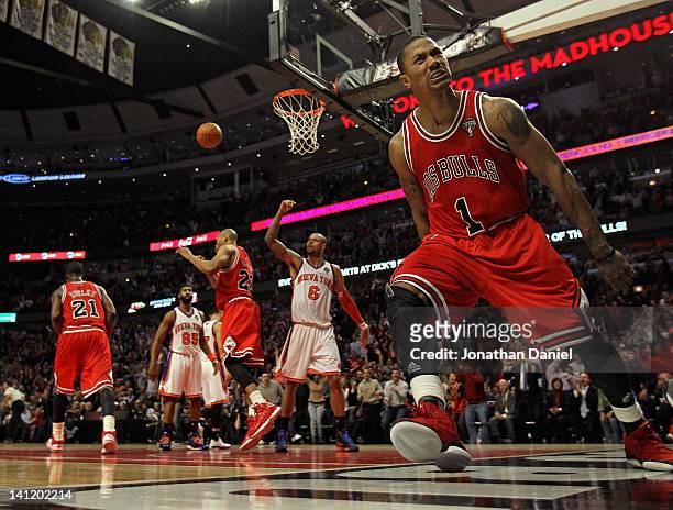 Derrick Rose of the Chicago Bulls lets out a scream after dunking the ball against the New York Knicks at the United Center on March 12, 2012 in...