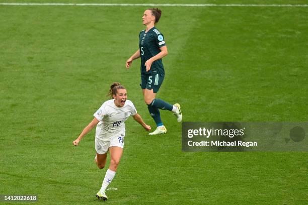 Marina Hegering of Germany reacts as Ella Toone of England celebrates scoring their side's first goal during the UEFA Women's Euro 2022 final match...
