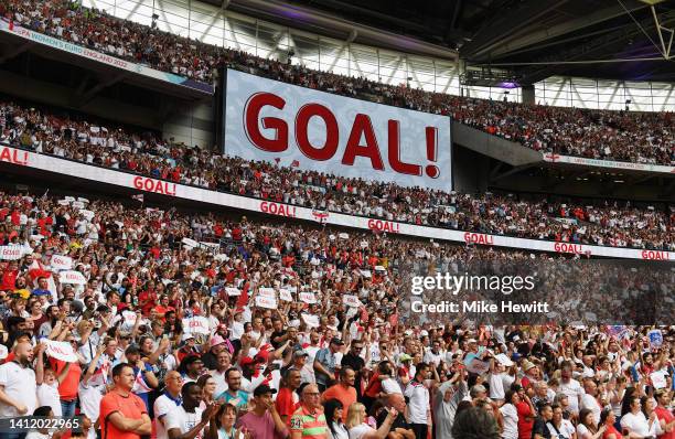 General view of the LED Screen on the inside of the stadium, which displays the message Goal!, as fans of England celebrate after Ella Toone of...