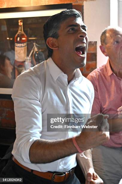 Conservative leadership hopeful Rishi Sunak celebrates England's first goal as he watches the Women's Euro 2022 Final with fans at the Bishops Mill...