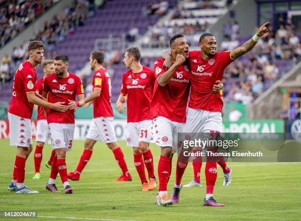 Delano Burgzorg of Mainz celebrates with Karim Onisiwo after scoring his team's second goal during the DFB Cup first round match between Erzgebirge...