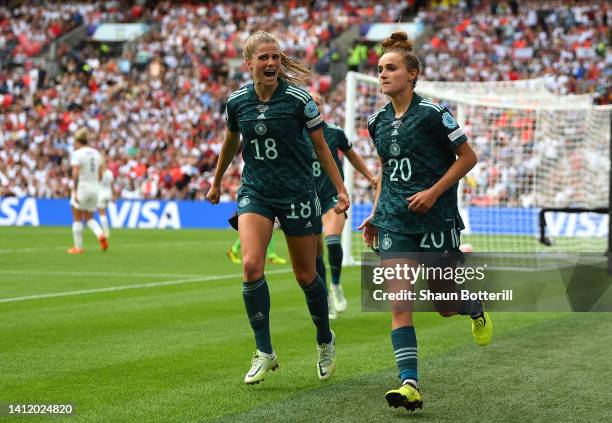 Lina Magull of Germany celebrates after scoring their side's first goal with Tabea Wassmuth during the UEFA Women's Euro 2022 final match between...