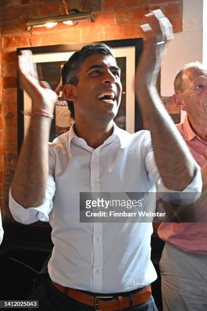 Conservative leadership hopeful Rishi Sunak celebrates England's first goal as he watches the Women's Euro 2022 Final with fans at the Bishops Mill...