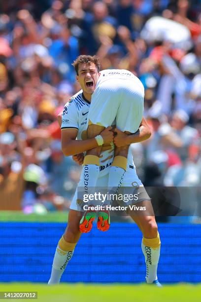 Jeronimo Rodriguez of Pumas UNAM celebrate with Juan Dinenno of Pumas UNAM after scoring his team’s first goal during the 6th round match between...