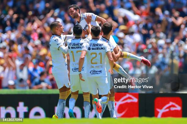 Jeronimo Rodriguez of Pumas UNAM celebrates with teammates after scoring his team’s first goal during the 6th round match between Pumas UNAM and...